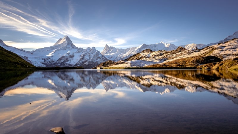 Sunrise over the lake and mountains in Bachalpsee, Switzerland