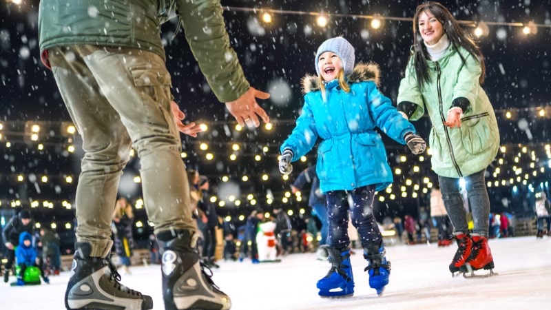 Family ice skating together