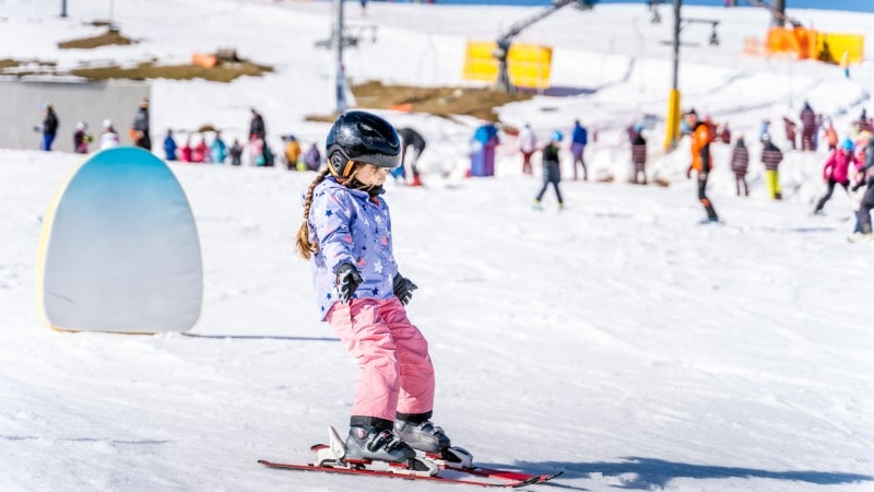 Young skier learning how to ski