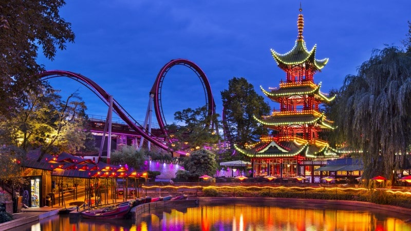 Tivoli Gardens amusement park in Copenhagen lit up at night