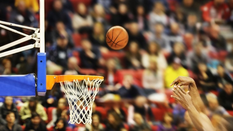 Basketball travelling towards the hoop