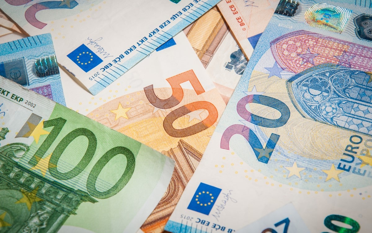 Euro bank notes scattered randomly