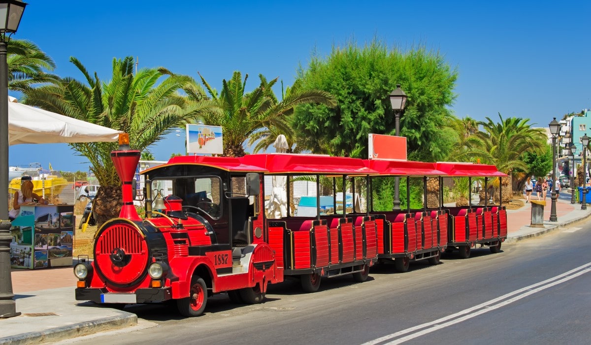 Holiday tourist train parked on the side of the road