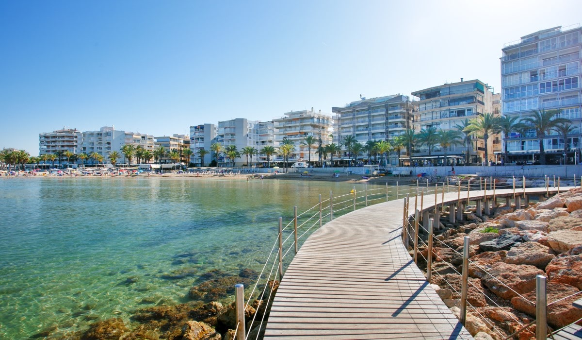 View of wooden walkway along Llevant Beach in Spain